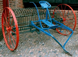 Old farm rake modified for use with a tractor