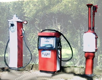 Photo of a small collection of Old petrol pumps at a small independent garrage