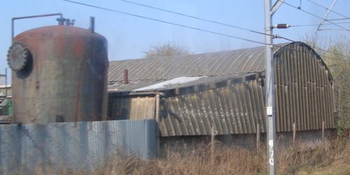 Photo showing building with corrugated asbestos cement cladding