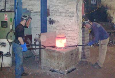 Photo showing Lifting the crucible
