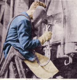 Photo of 1930s arc welder at work