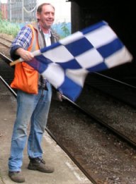 Photo of a 'flag man' wearing a high visibility jerkin in 2006