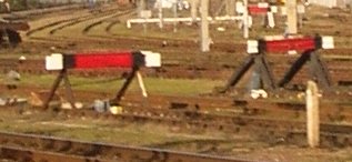Photo of modern rail-built buffer with red painted cross members