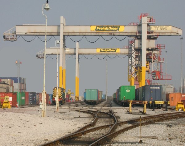 Photo of a modern Freightliner terminal, cranes span six tracks