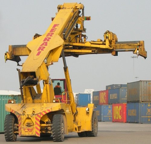 Photo of a modern Freightliner terminal reach stacker container handling crane