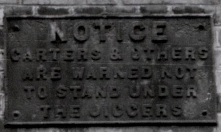 Warning notice mounted by a jigger at a LNWR large goods warehouse in Stockport